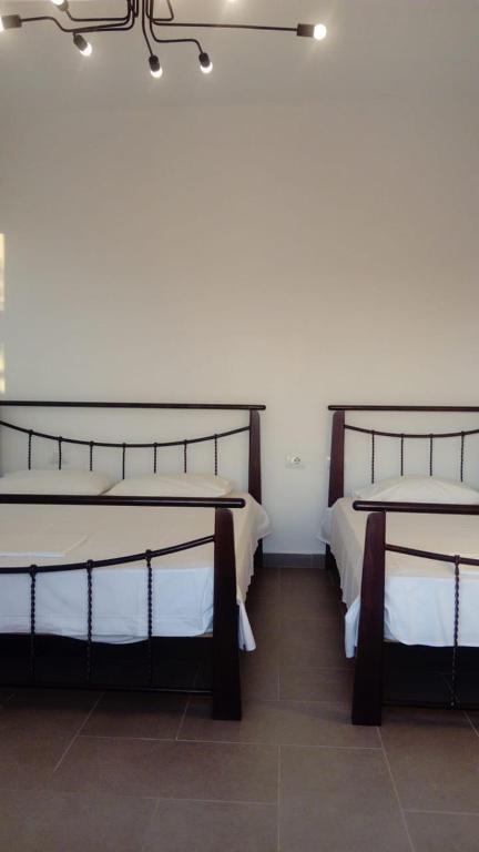 Postel nebo postele na pokoji v ubytování Valentina Rooms