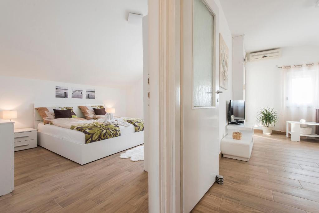Postel nebo postele na pokoji v ubytování Apartments Batur