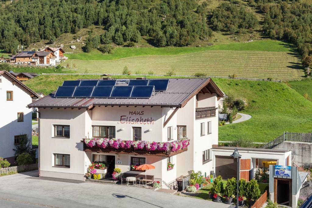 a building with solar panels on the roof at Haus Elisabeth in Galtür