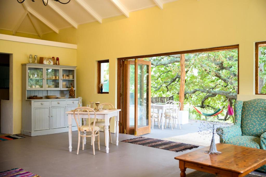 a kitchen and dining room with a table and chairs at Laughing Waters Farm in Stanford