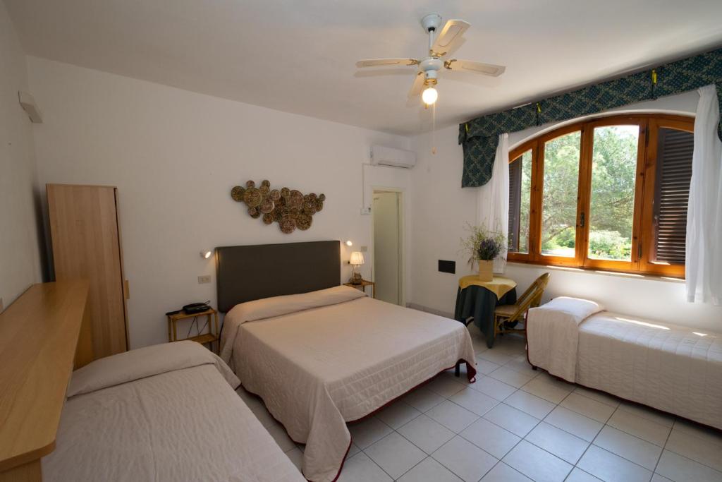 Postel nebo postele na pokoji v ubytování Hotel Giardino