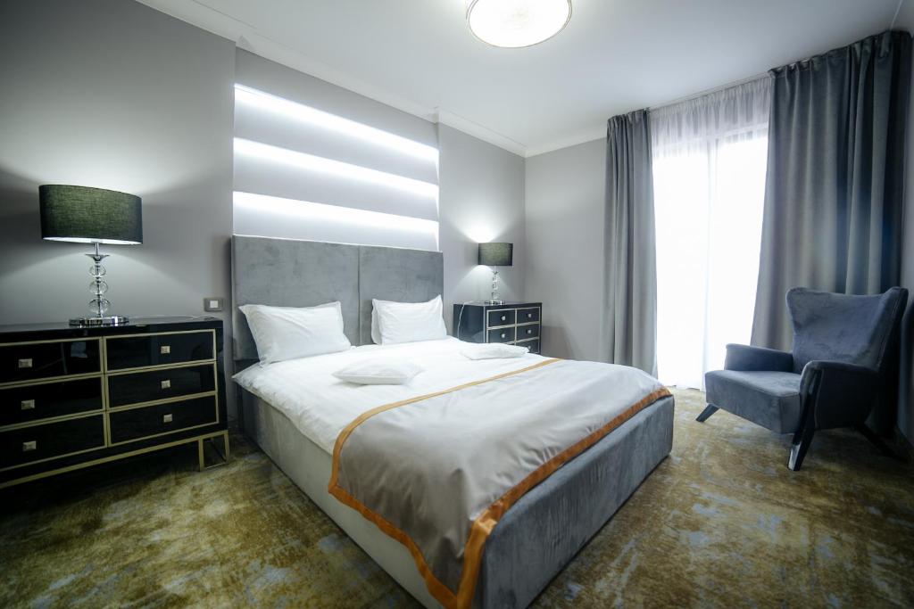 Postel nebo postele na pokoji v ubytování Royal Class Hotel