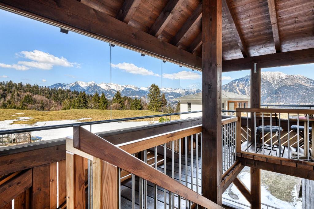 a large balcony with a view of mountains at Chalet Fischer by A-Appartments in Bürserberg