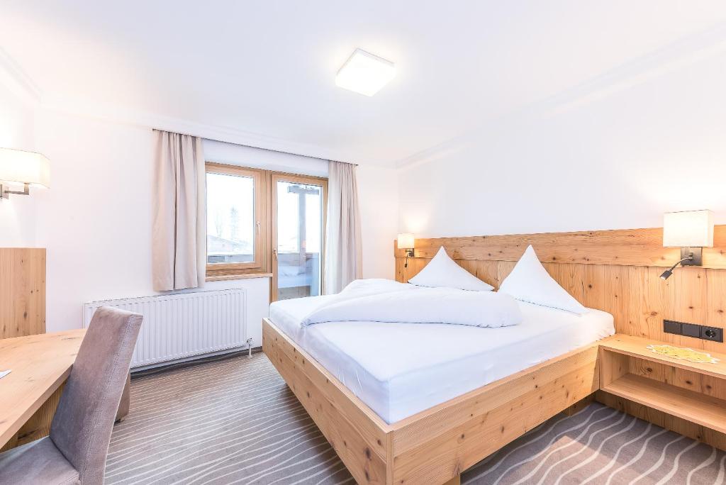Postel nebo postele na pokoji v ubytování Pension Restaurant Dorfalm