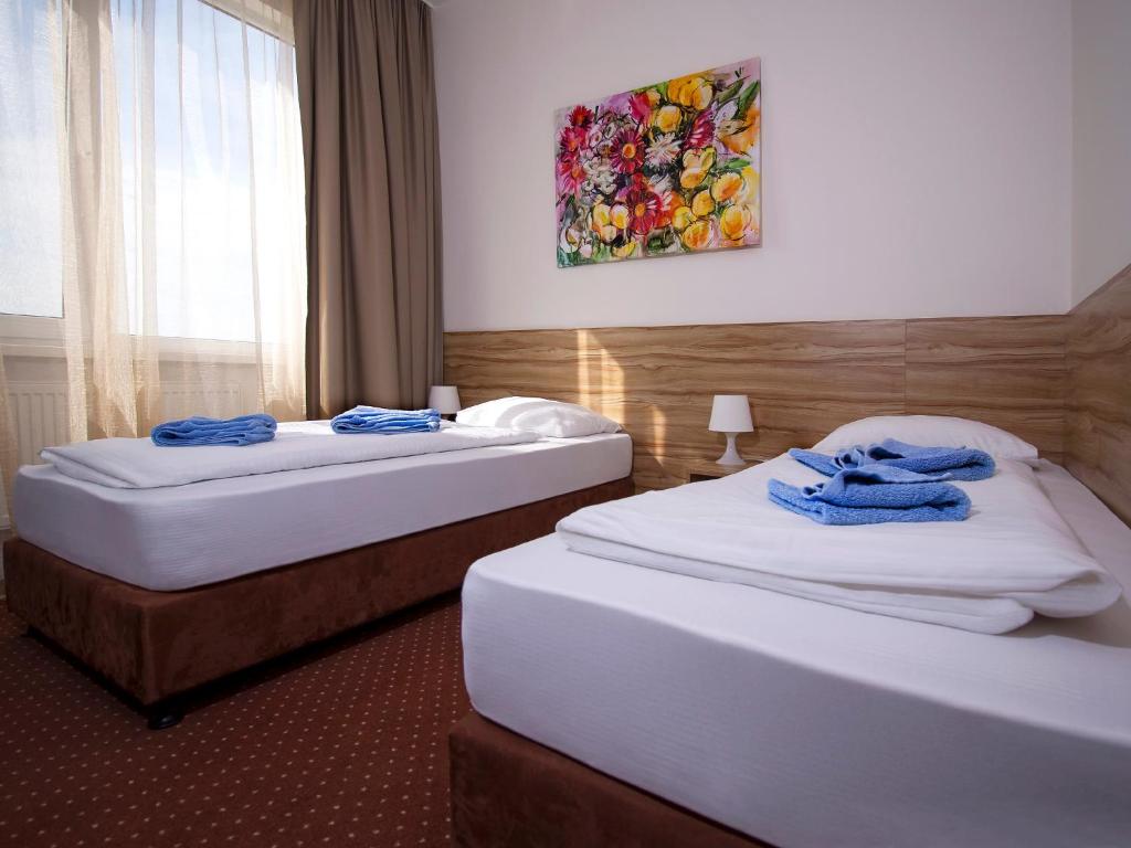 Postel nebo postele na pokoji v ubytování Aviator Garni Hotel Bratislava