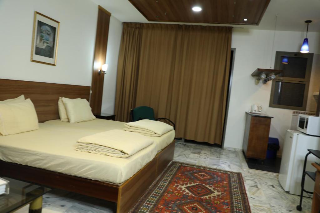 Postel nebo postele na pokoji v ubytování Viccini Suites