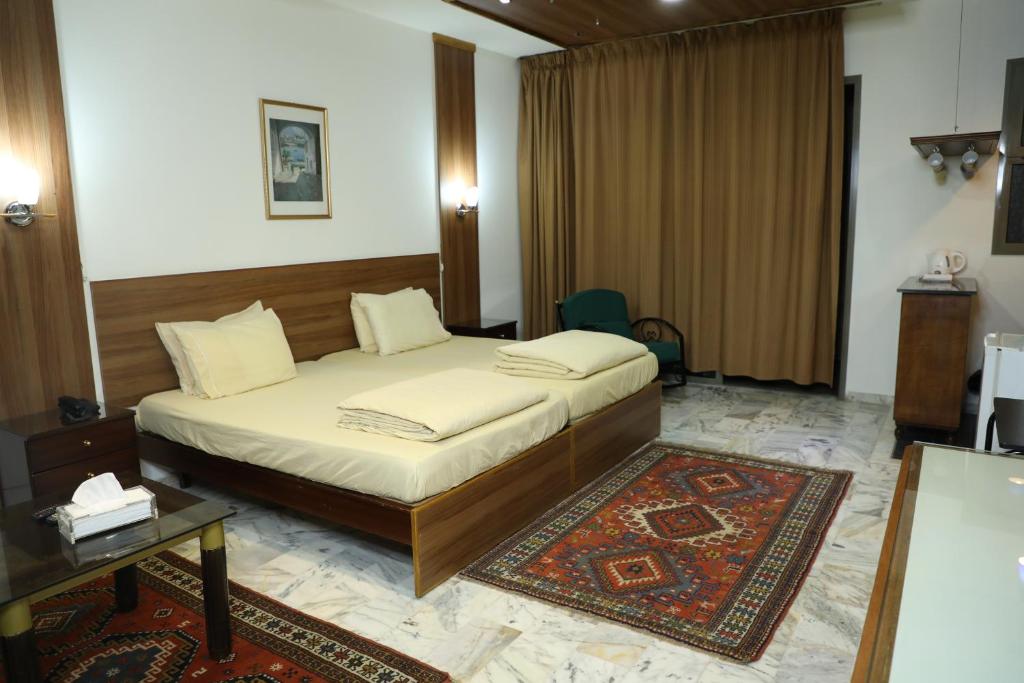 Postel nebo postele na pokoji v ubytování Viccini Suites