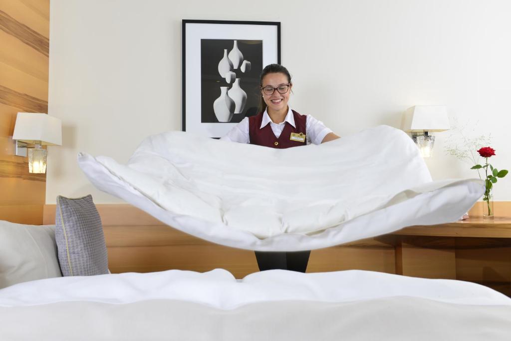 Postel nebo postele na pokoji v ubytování Hotel Torbräu