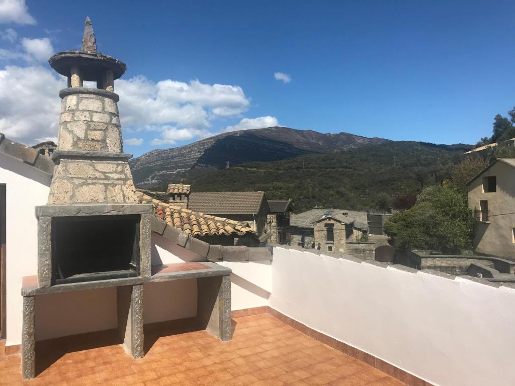 a brick oven on the roof of a house at Casa Murillo in Boltaña