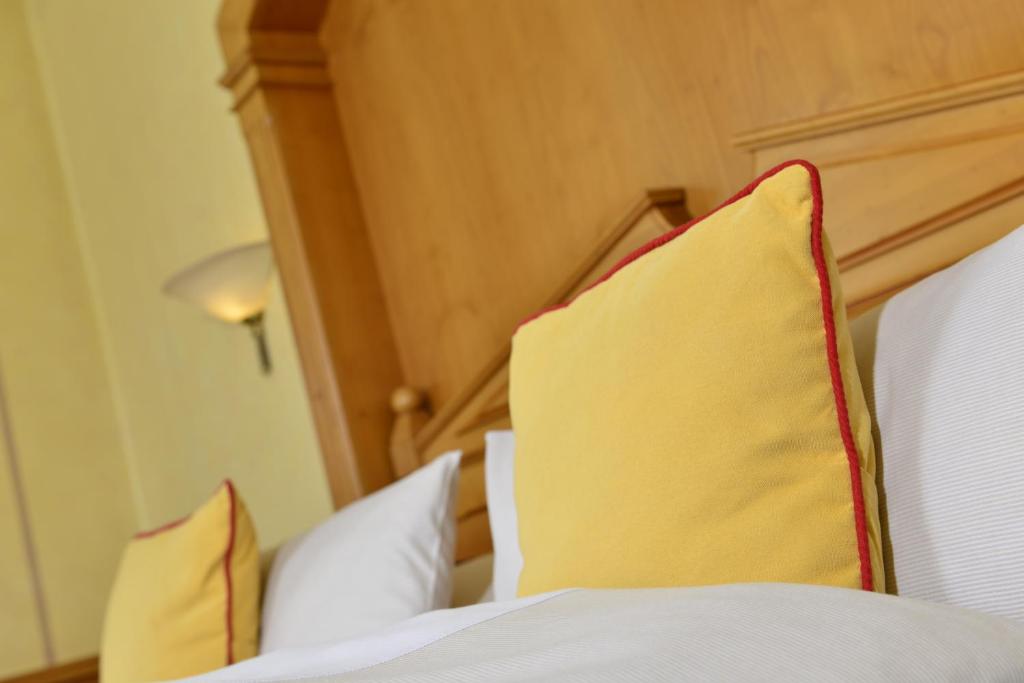 Postel nebo postele na pokoji v ubytování Hotel Torbräu