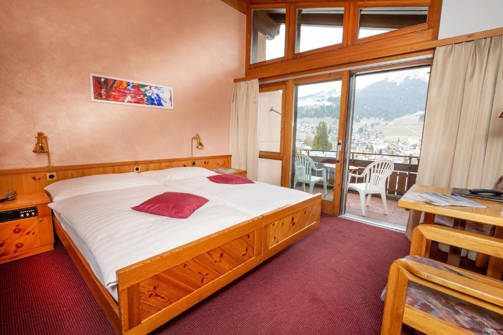 Postel nebo postele na pokoji v ubytování T3 Hotel Mira Val