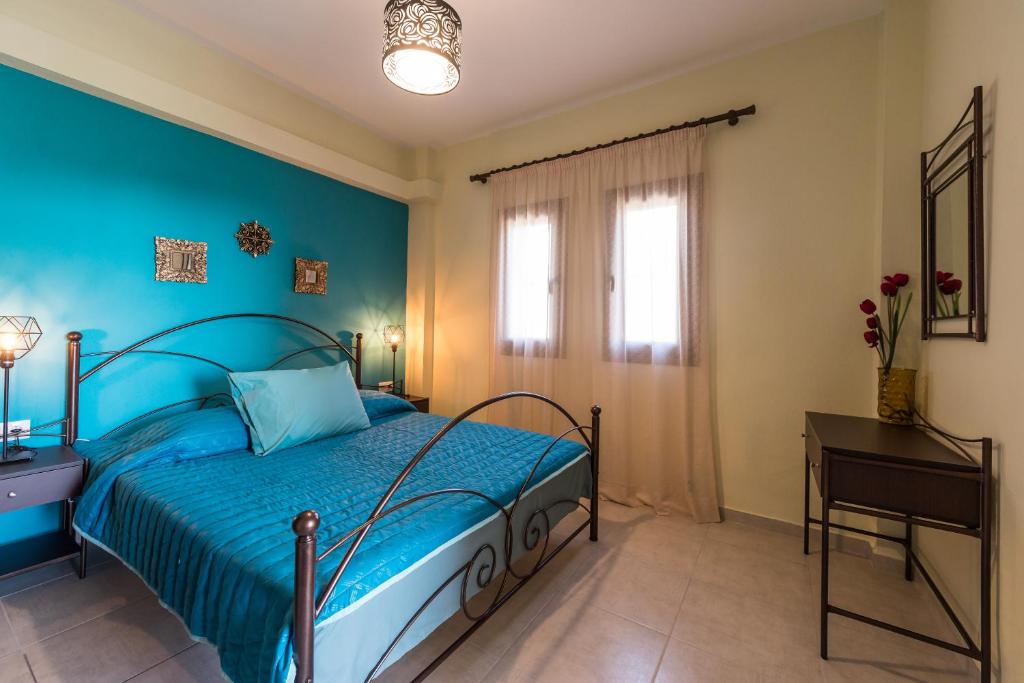 Posteľ alebo postele v izbe v ubytovaní Roxani's Apartments