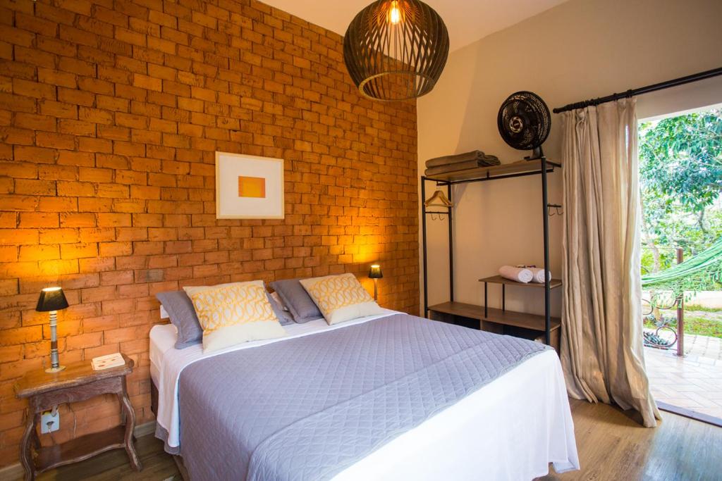 Postel nebo postele na pokoji v ubytování Vilarejo Guesthouse - Silêncio e Aconchego