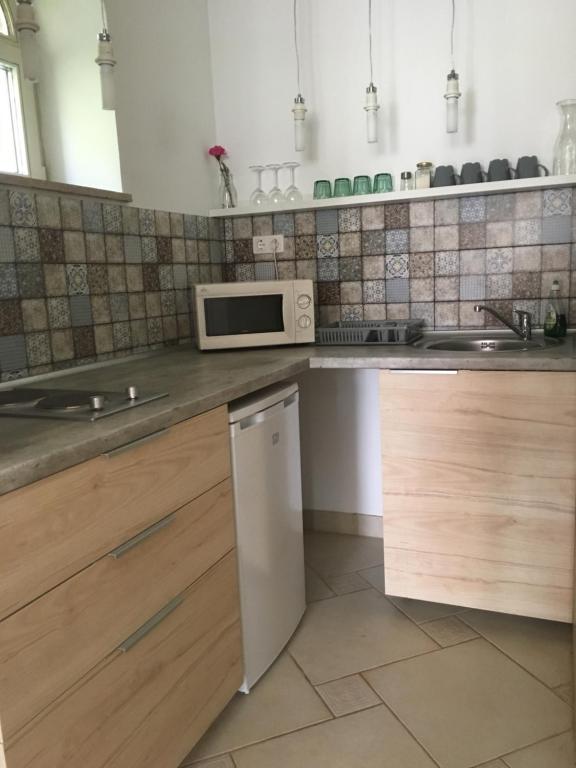 Kuchyň nebo kuchyňský kout v ubytování Szélrózsa apartmanház
