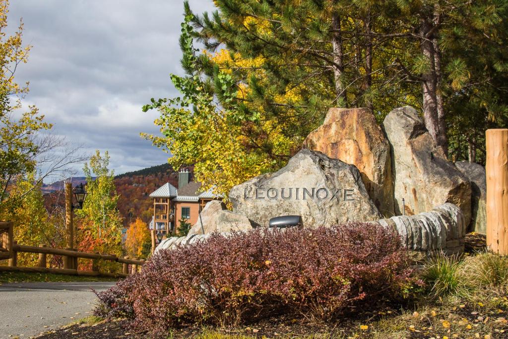 a large rock with the word boulder on it at Equinoxe by Rendez-Vous Mont-Tremblant in Mont-Tremblant