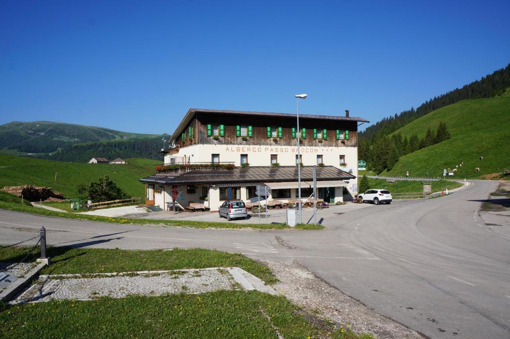 a large building on the side of a road at Albergo Passo Brocon in Castello Tesino