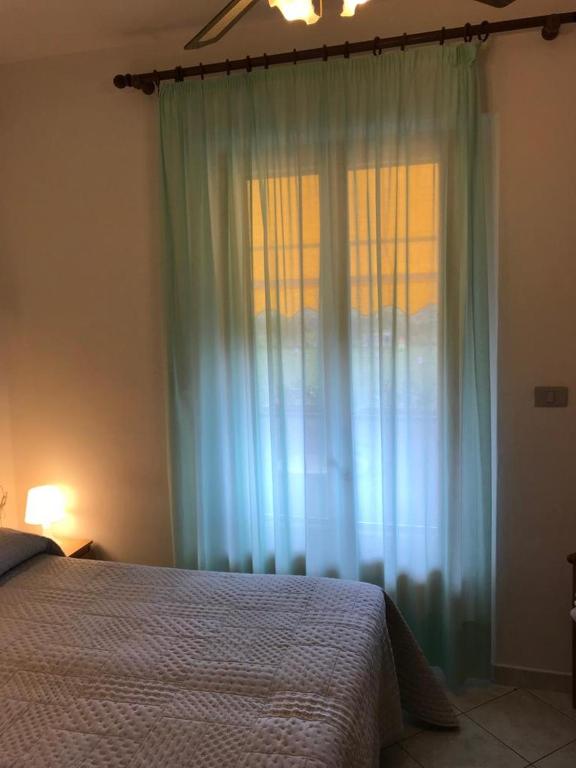 Postel nebo postele na pokoji v ubytování Hotel B&B Rispescia Grosseto