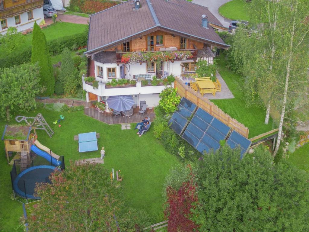 an aerial view of a house with a backyard at Animal friendly apartment in Leogang in Leogang