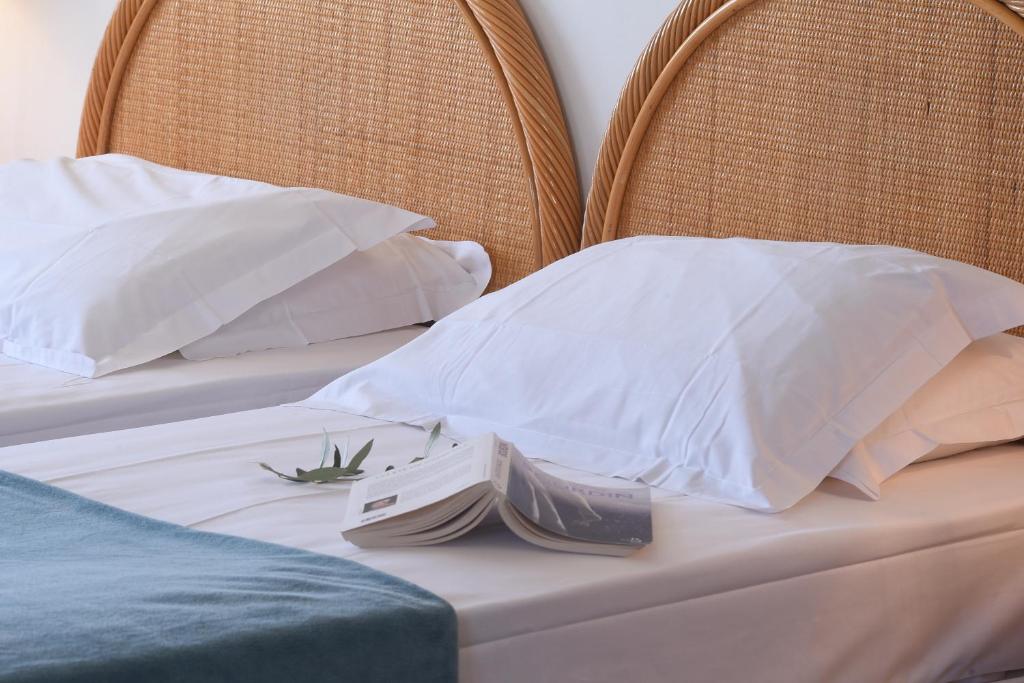 Postel nebo postele na pokoji v ubytování Hotel Le Tilbury