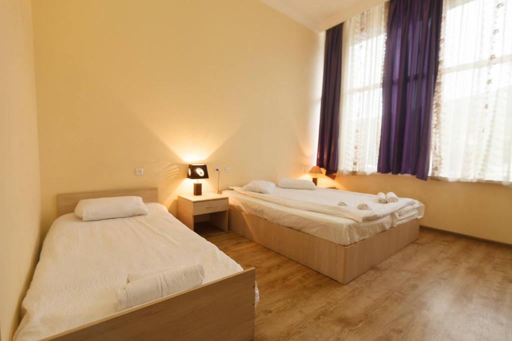 Postel nebo postele na pokoji v ubytování Ortachala Palace