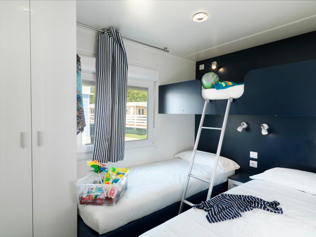 Postel nebo postele na pokoji v ubytování Barricata Holiday Village