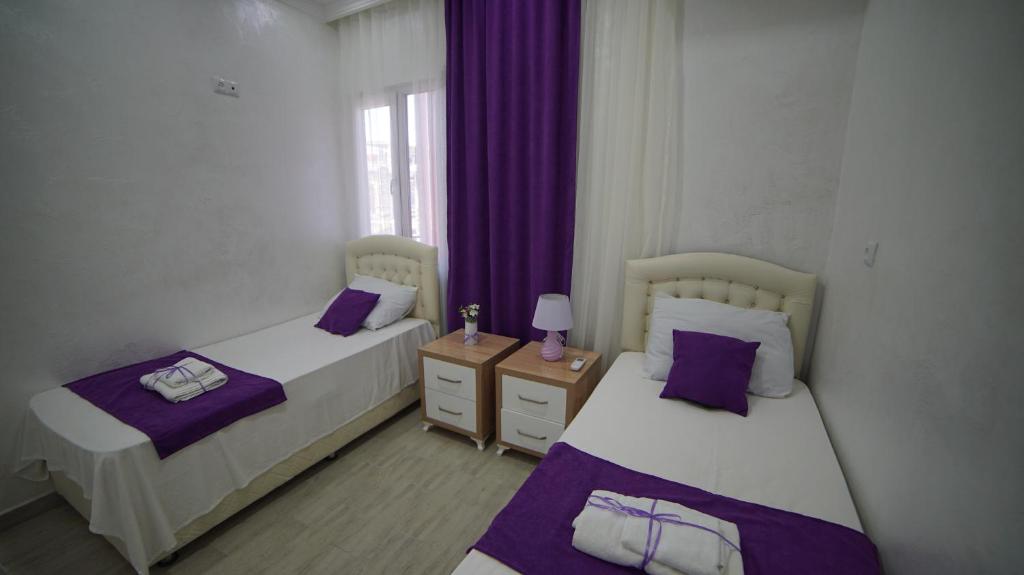 Postel nebo postele na pokoji v ubytování Nikas Guest House