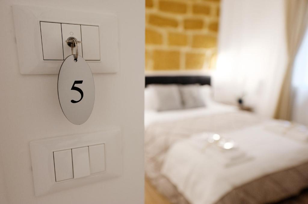 Postel nebo postele na pokoji v ubytování Gocce di Girgenti - comfort suites