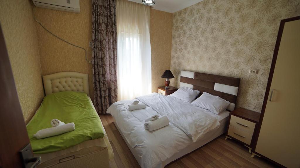 Postel nebo postele na pokoji v ubytování Nana's House