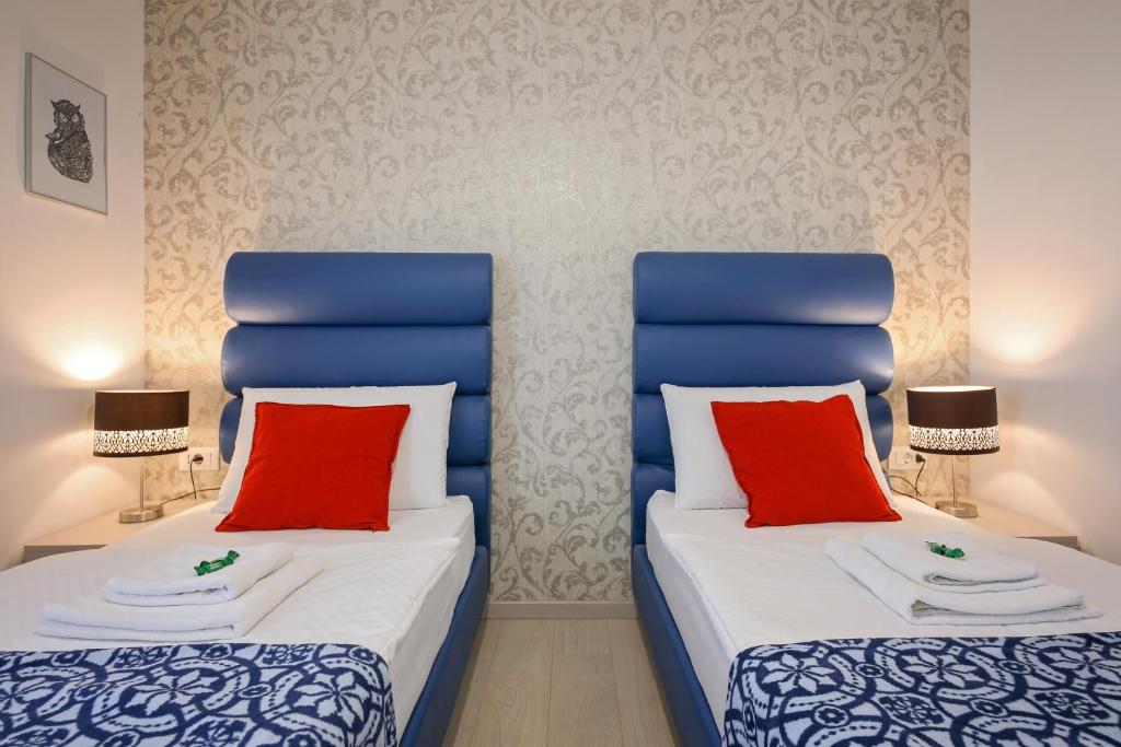 Postel nebo postele na pokoji v ubytování San Martino Rooms