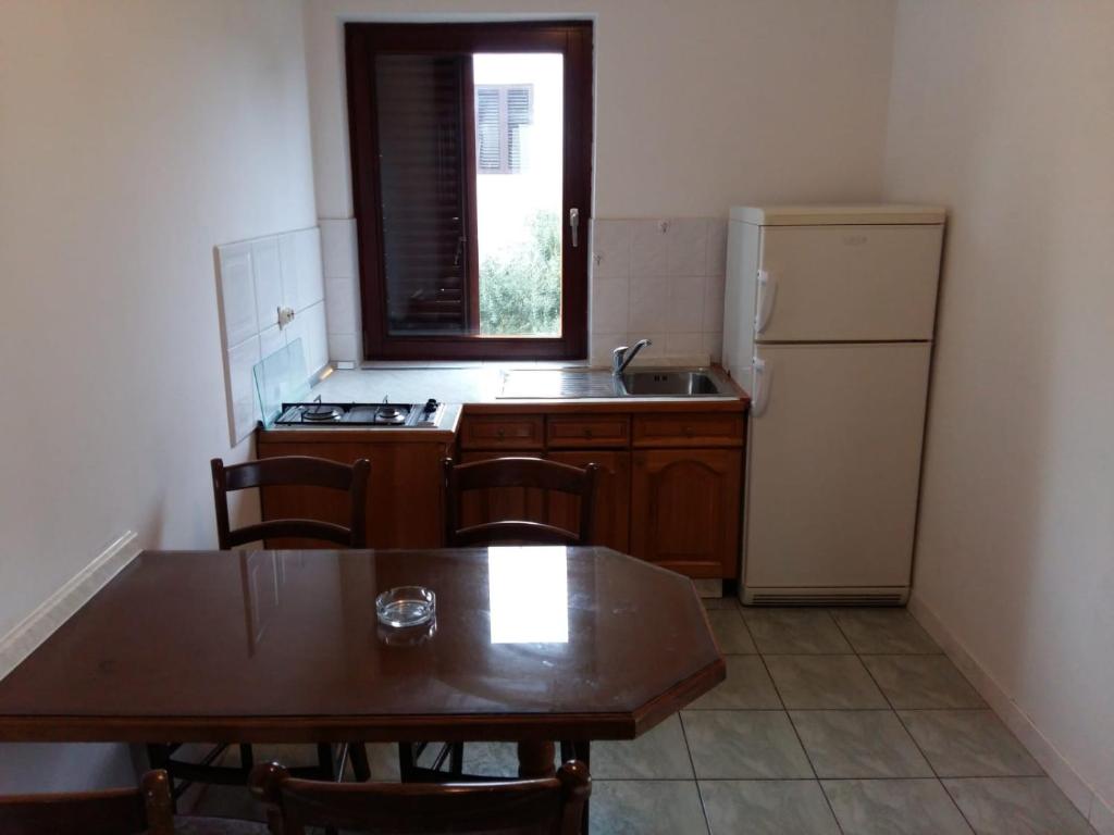 Kuchyň nebo kuchyňský kout v ubytování Apartments Villa Cherry