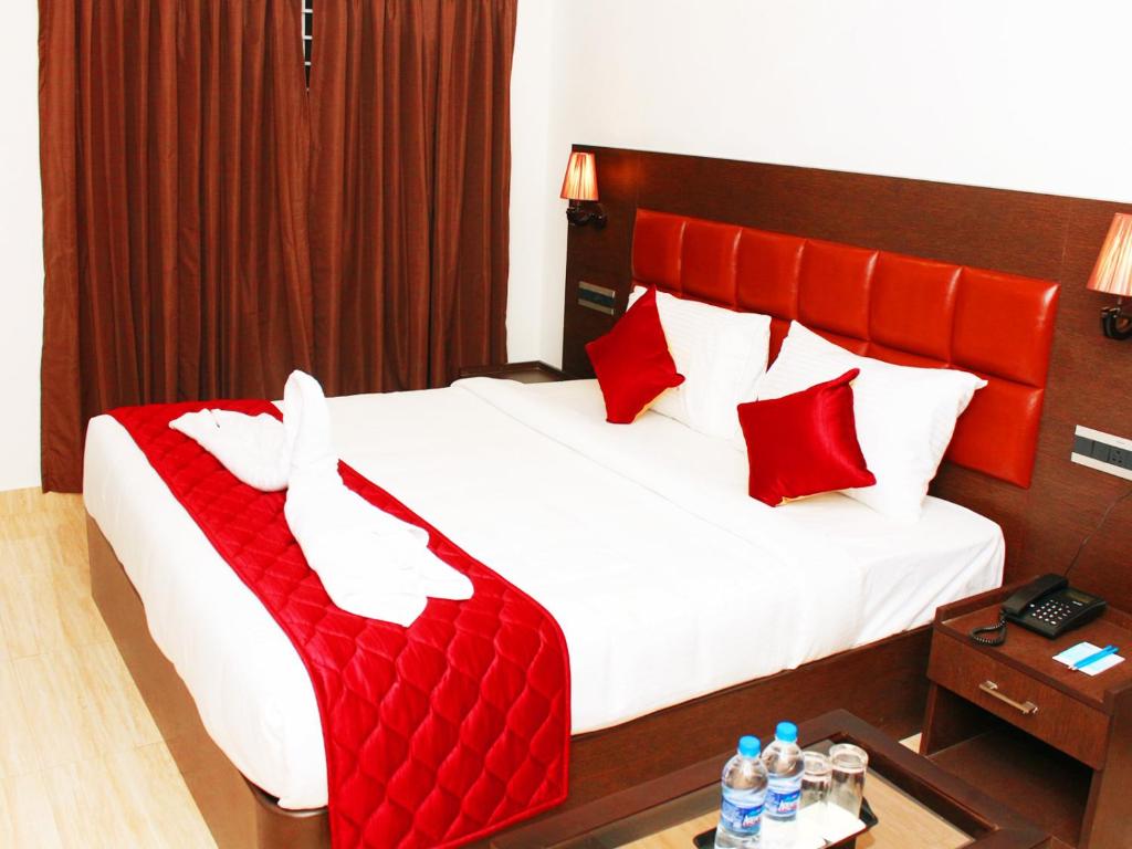 Postel nebo postele na pokoji v ubytování Staylite Suites