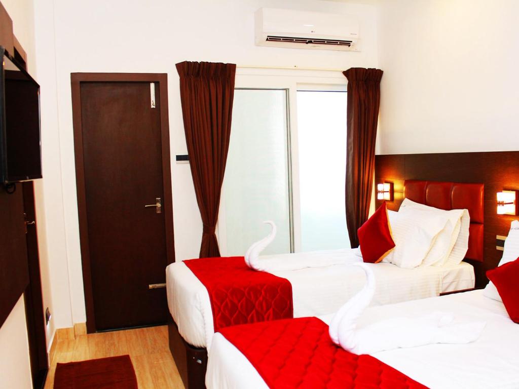 Postel nebo postele na pokoji v ubytování Staylite Suites