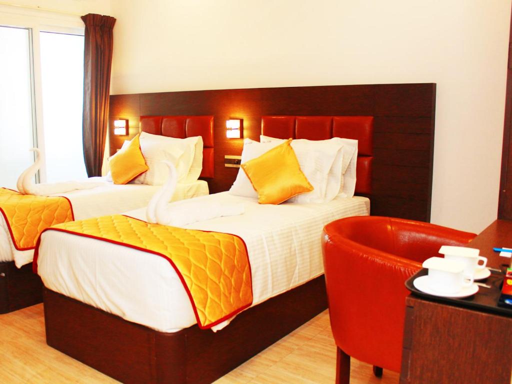 Postel nebo postele na pokoji v ubytování Staylite Suites