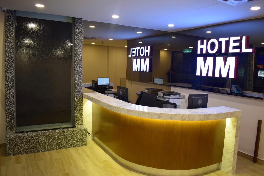 a hotel lobby with a hotel mtn sign on the wall at Hotel MM @ Sunway in Petaling Jaya