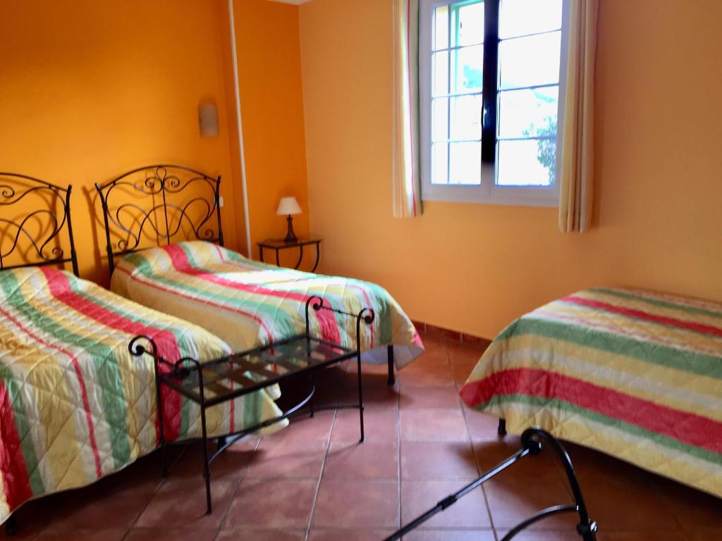 Postel nebo postele na pokoji v ubytování Hotel Du Vignoble