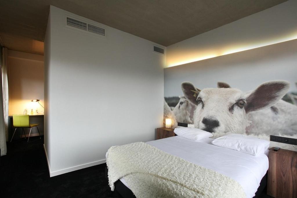 Postel nebo postele na pokoji v ubytování Hotel The Lodge Vilvoorde