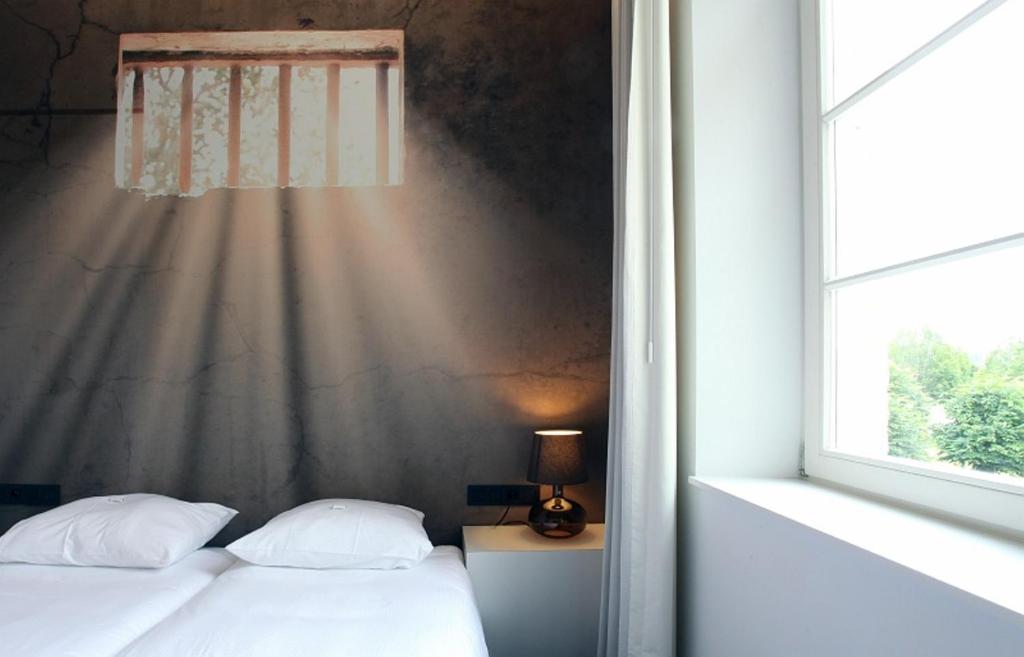 Postel nebo postele na pokoji v ubytování Hotel The Lodge Vilvoorde