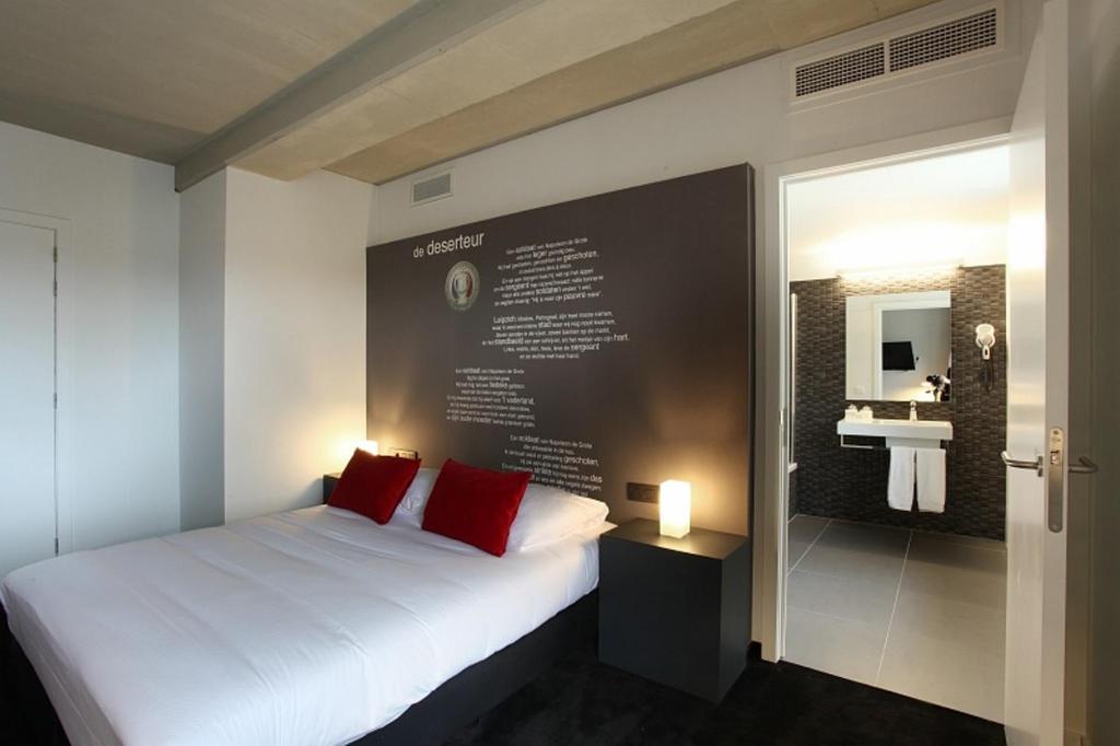 Postel nebo postele na pokoji v ubytování Hotel The Lodge Vilvoorde