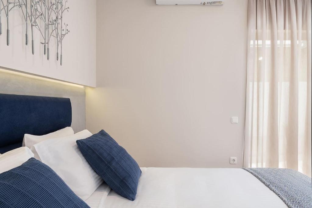 Posteľ alebo postele v izbe v ubytovaní Anemone Holiday Apartment