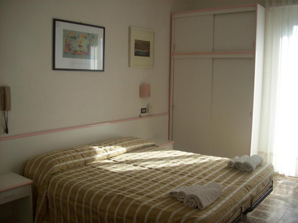 Postel nebo postele na pokoji v ubytování Hotel Rosy