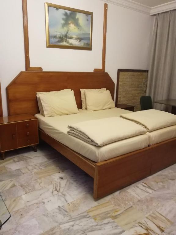 Postel nebo postele na pokoji v ubytování Viccini Suites