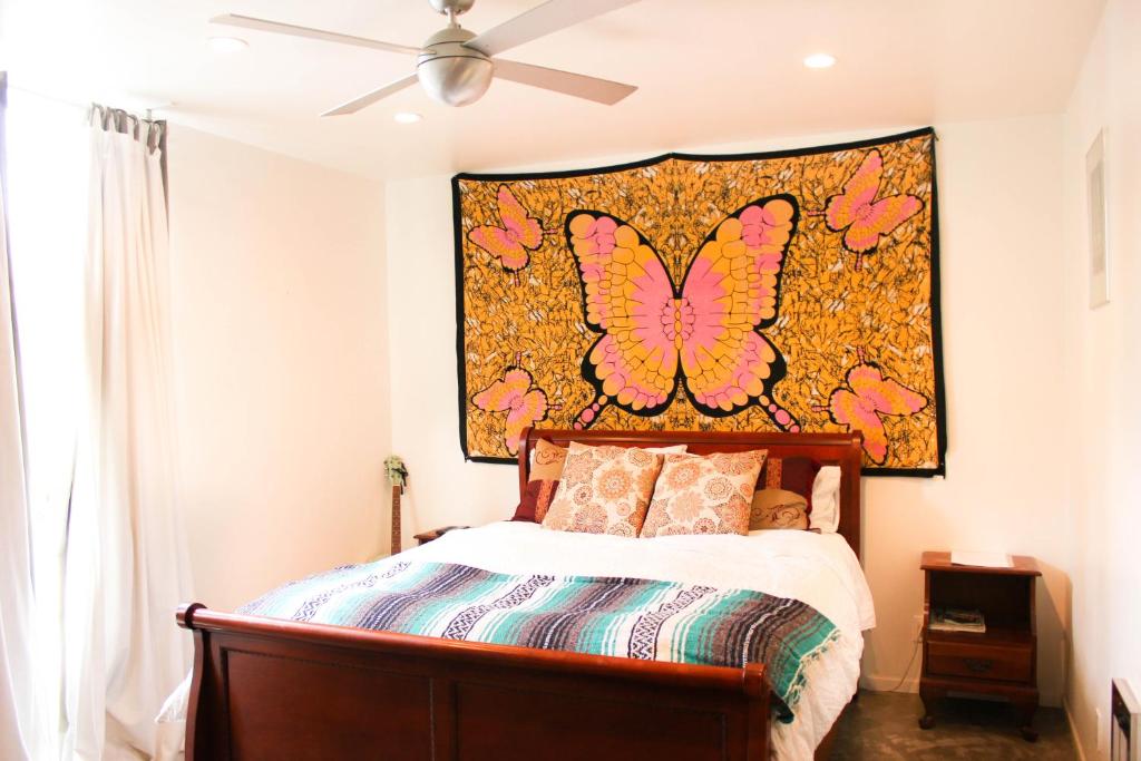 A bed or beds in a room at Ocean Front Vortex Female Hostel private rooms Free bikes