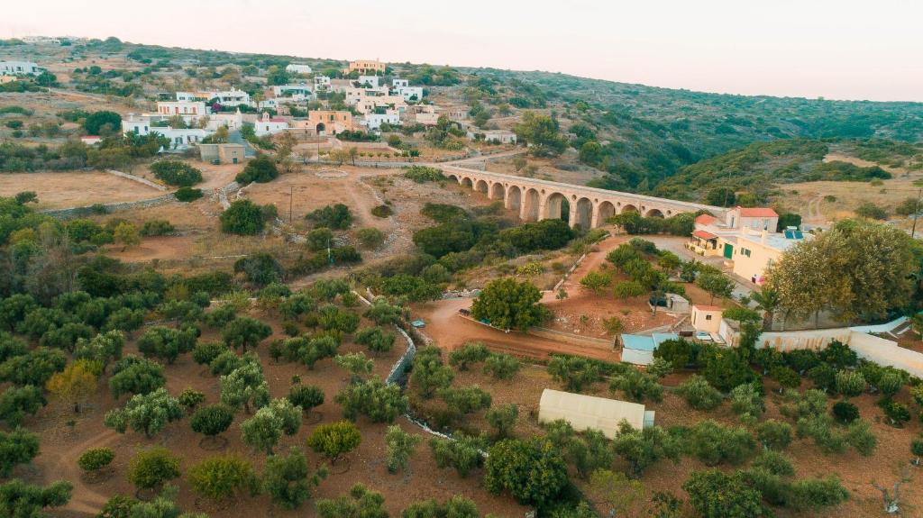 an aerial view of a village with a bridge at Theofilos Appartements in Livadi