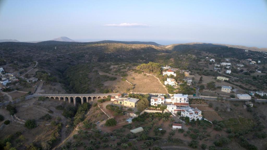 an aerial view of a small town with a bridge at Theofilos Appartements in Livadi
