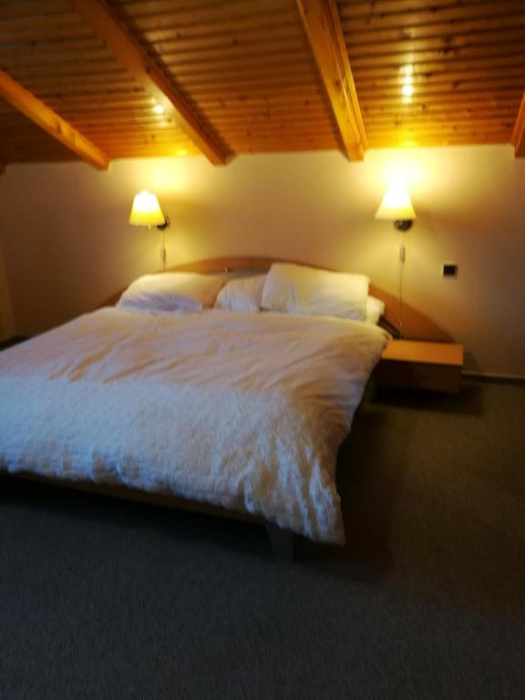 Postel nebo postele na pokoji v ubytování Nature Apartments