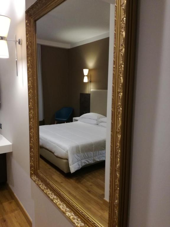 Postel nebo postele na pokoji v ubytování Hotel Umbria