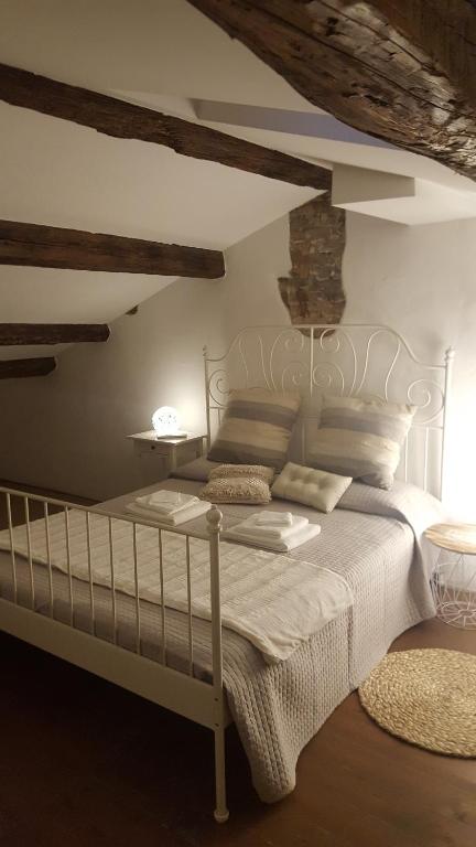 Posteľ alebo postele v izbe v ubytovaní La Casa sui Portici