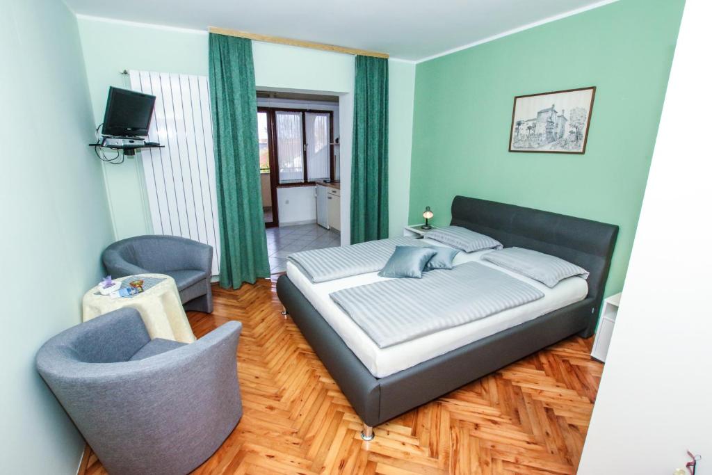 Postel nebo postele na pokoji v ubytování Apartments Ritoša