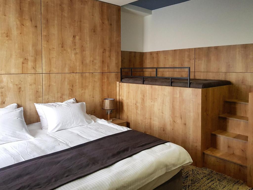Postel nebo postele na pokoji v ubytování Hotel Alpha
