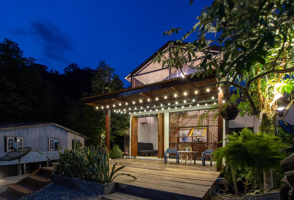 a house with a deck with lights on it at Escape Life Koh Kood in Ko Kood